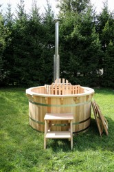 Wooden hot tub with the inside furnace.